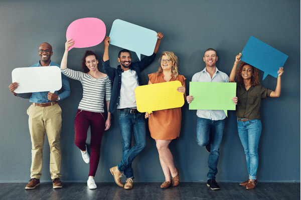 People holding voice carboard cuttouts